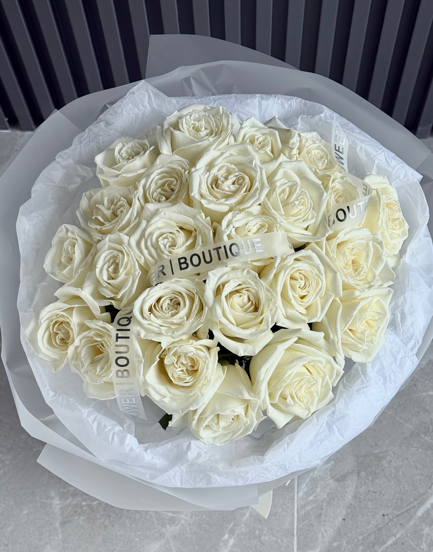 Classic 24 white roses bouquet with soft ribbon detail