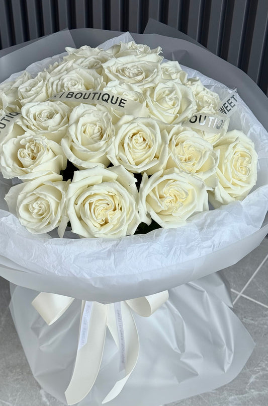 Elegant bouquet of twenty four white roses with clean minimalist design