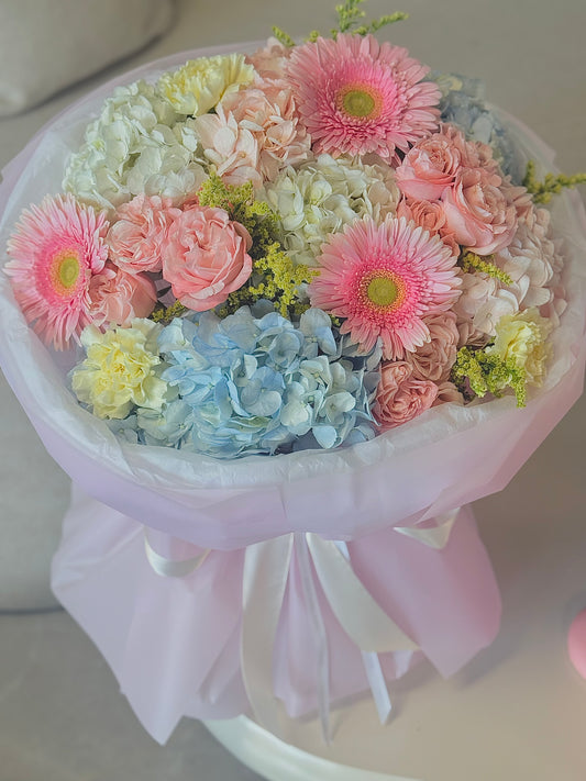 Luxury Summer Garden Bouquet featuring blue hydrangeas, blush roses, pink gerberas, and carnations for same-day flower delivery in Toronto
