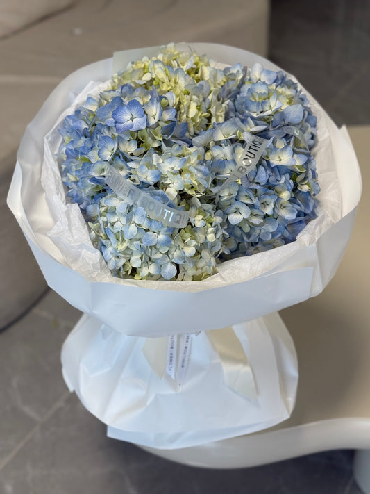 Blue and white hydrangea bouquet cloud style floral arrangement