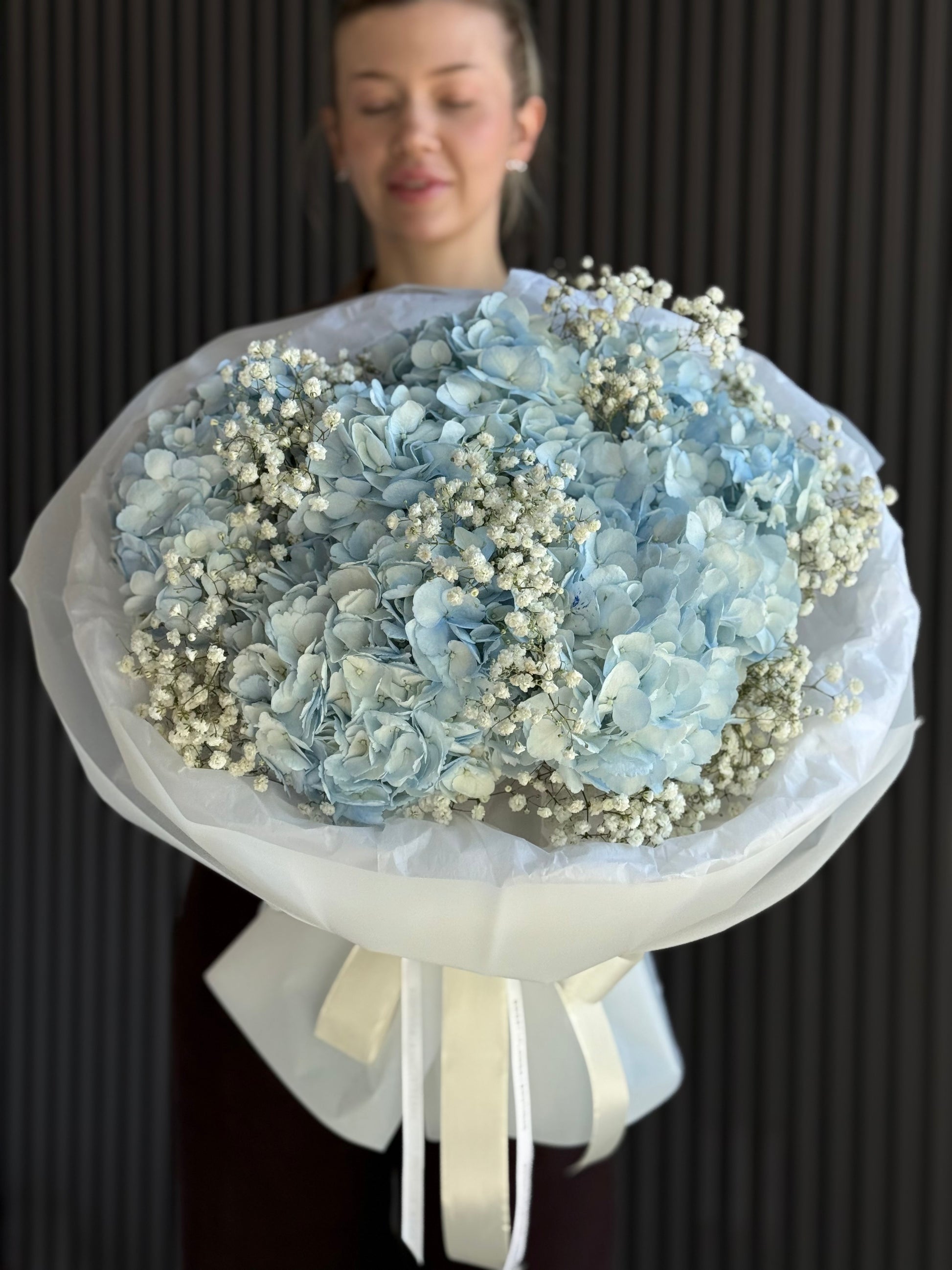 Luxury blue hydrangea bouquet with baby’s breath in premium white wrapping by Sweet Flower Boutique Toronto

