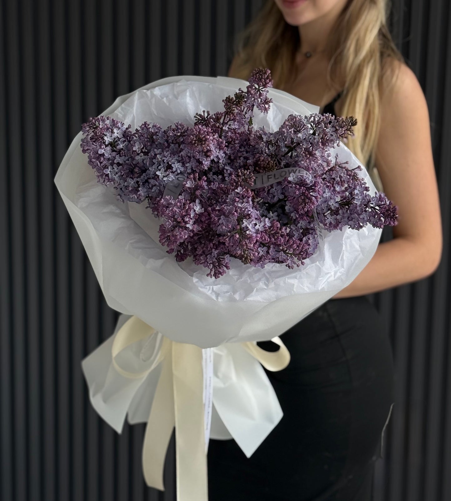 Luxury purple lilac bouquet with European-style wrapping