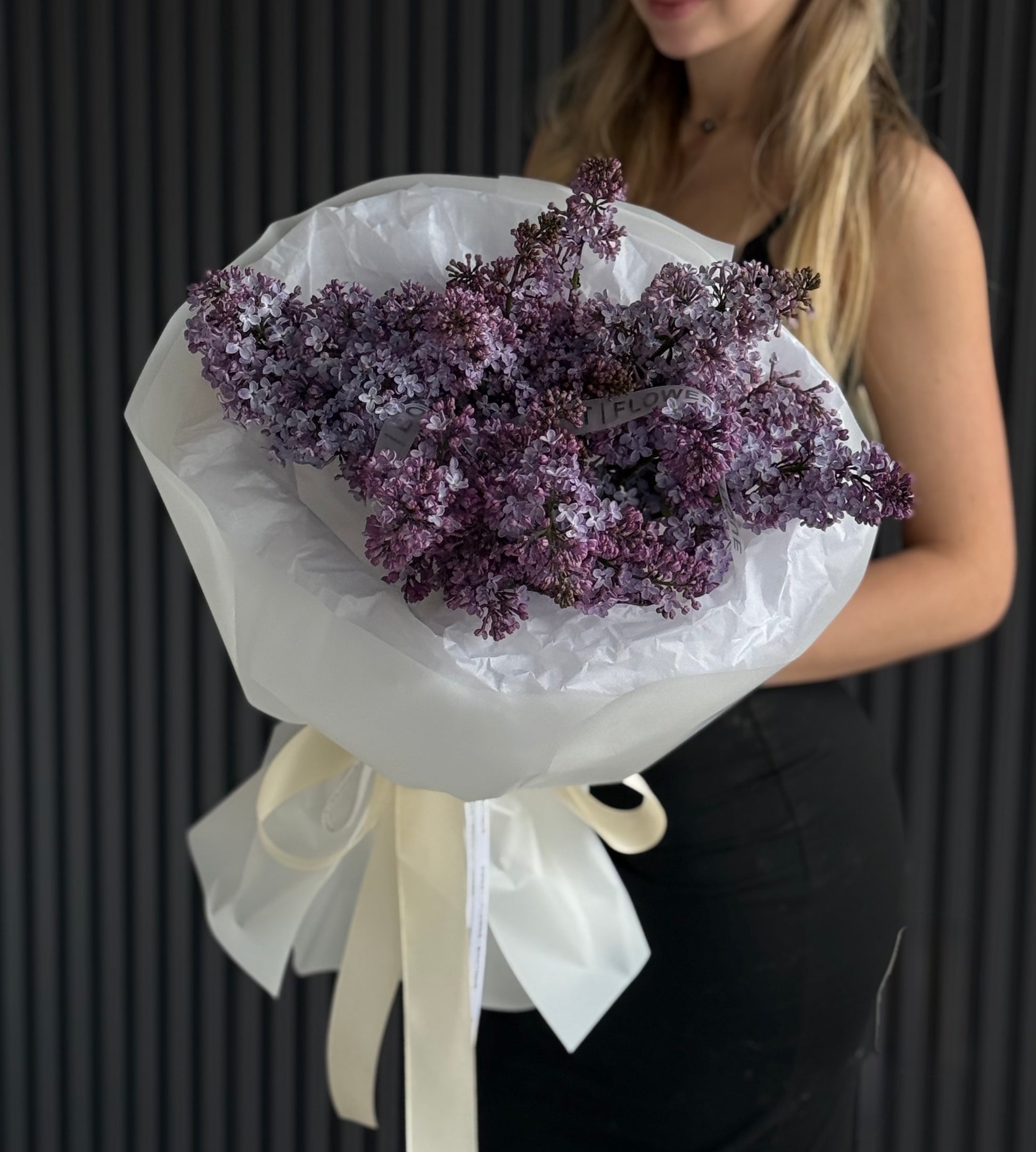 Luxury purple lilac bouquet with European-style wrapping