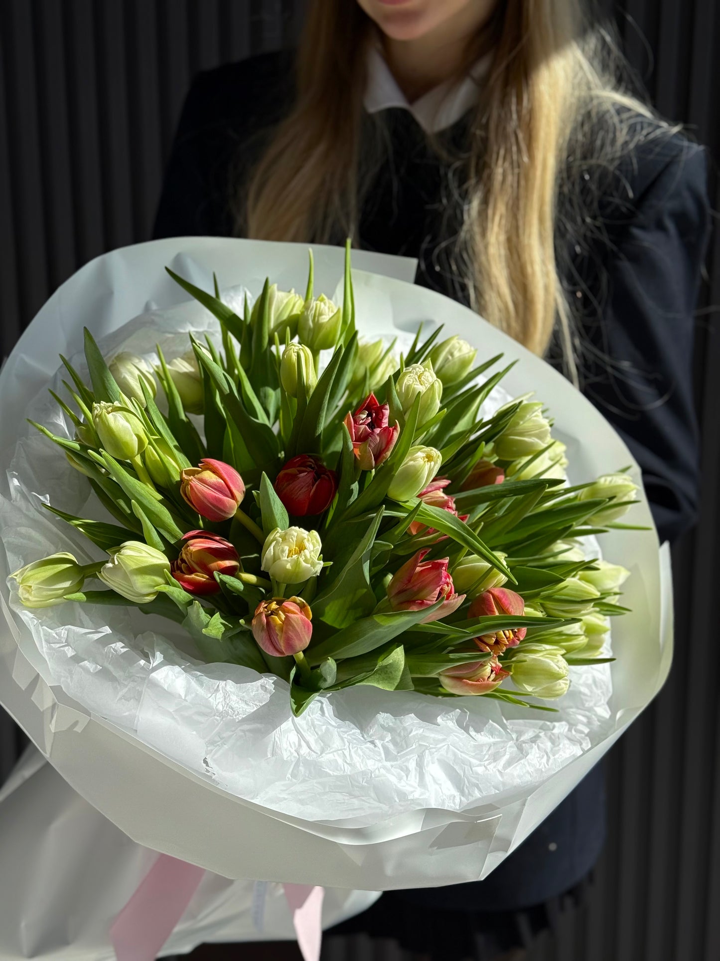 White and pink local double tulip bouquet with layered peony-style petals wrapped in luxury paper, available for same-day delivery in Toronto.