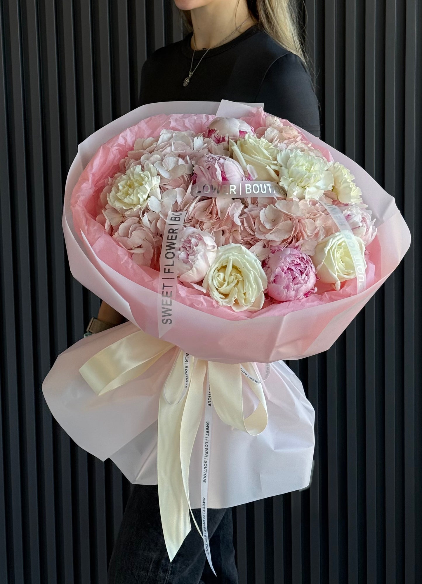 Soft pink peony bouquet with hydrangeas and ivory roses