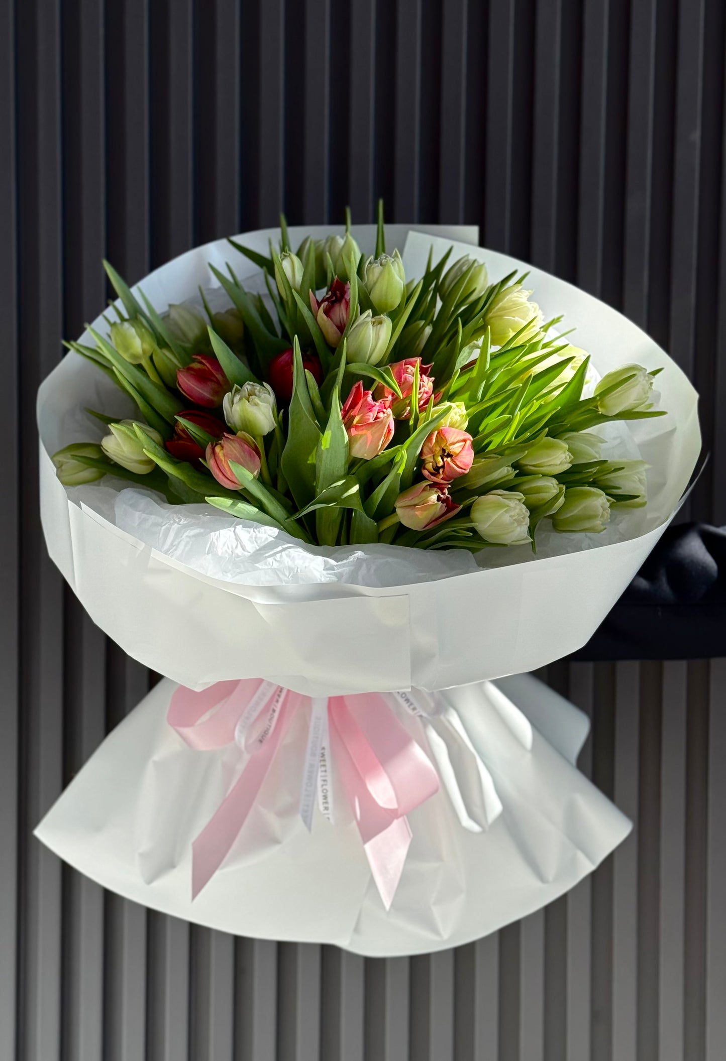 Elegant white and pink double tulip bouquet in luxury paper wrapping, available for same-day tulip delivery and pickup in Toronto.
