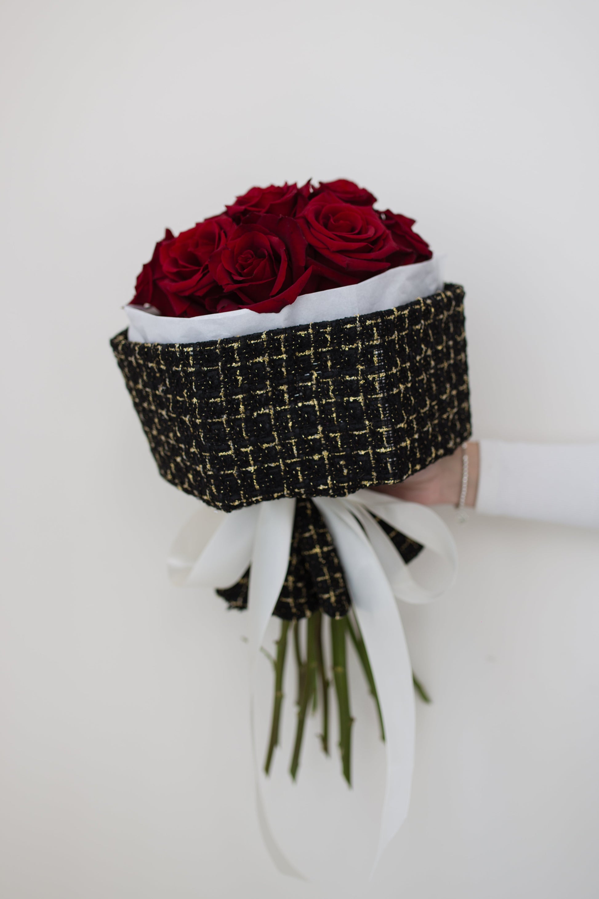 12 red roses bouquet wrapped in black tweed fabric, luxury flower delivery Toronto