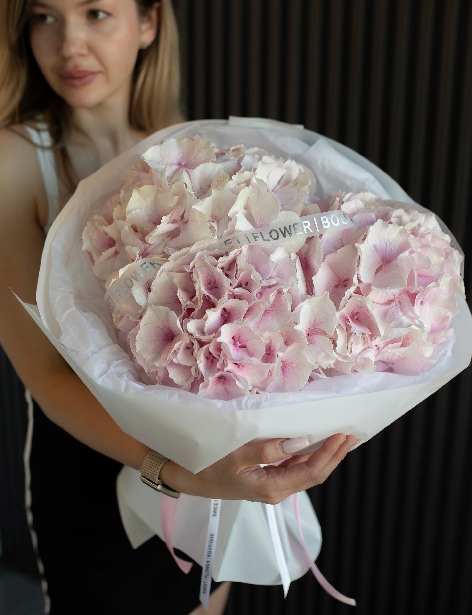 Fresh locally grown pink hydrangeas in luxury bouquet wrapping