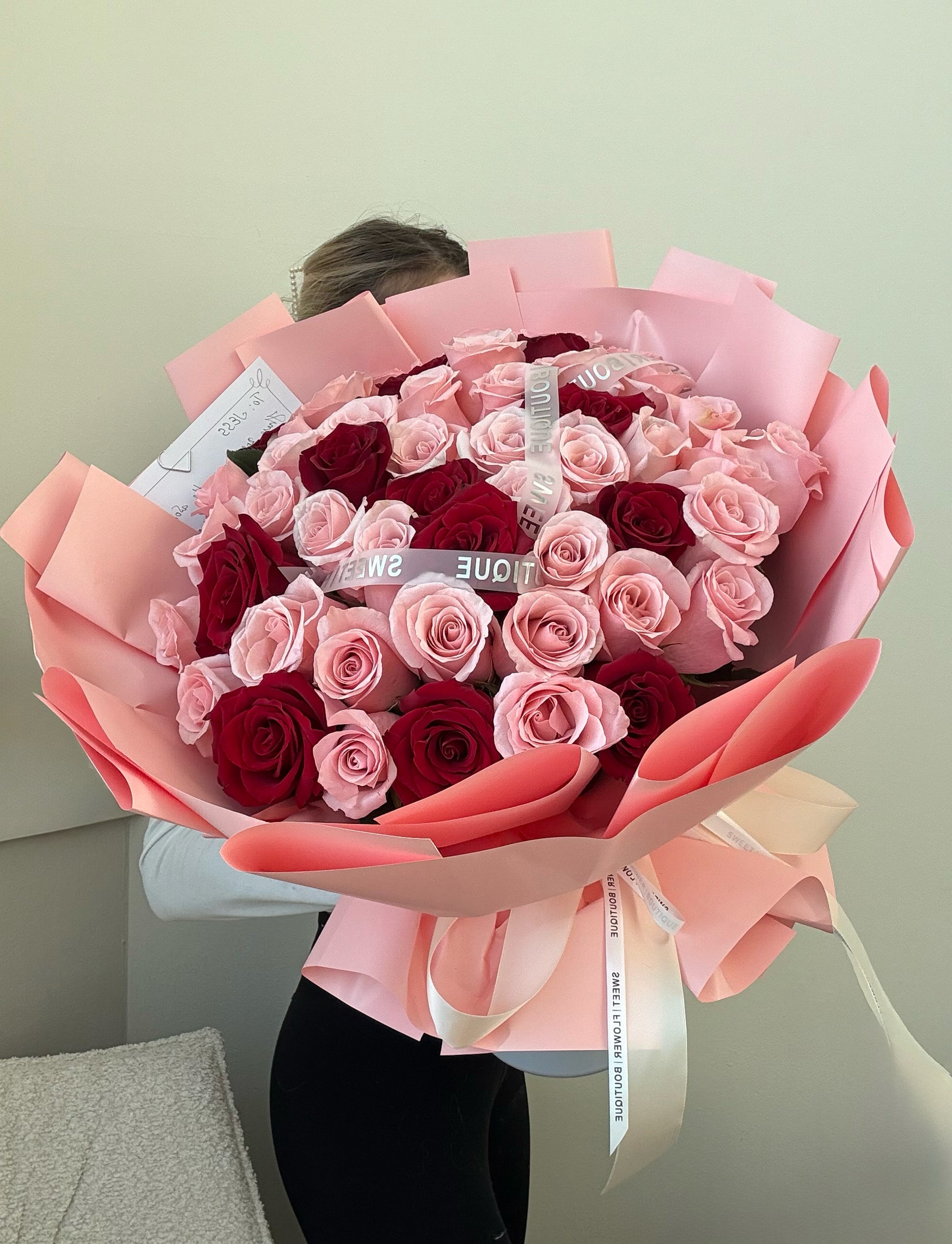 Luxury mixed rose bouquet with blush pink and red roses, romantic flower gift