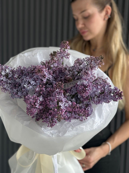 5 stem lavender lilac bouquet wrapped in white paper