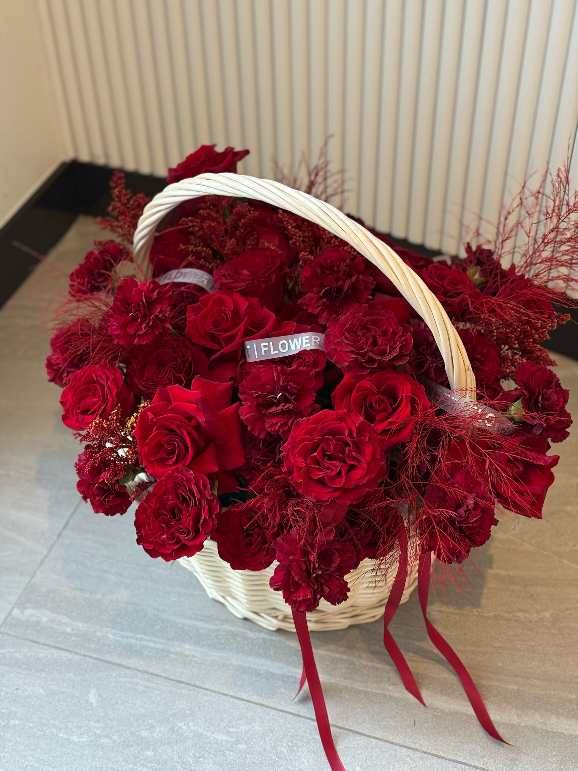 Elegant red flower basket crafted from natural rattan, luxury floral gift Toronto
