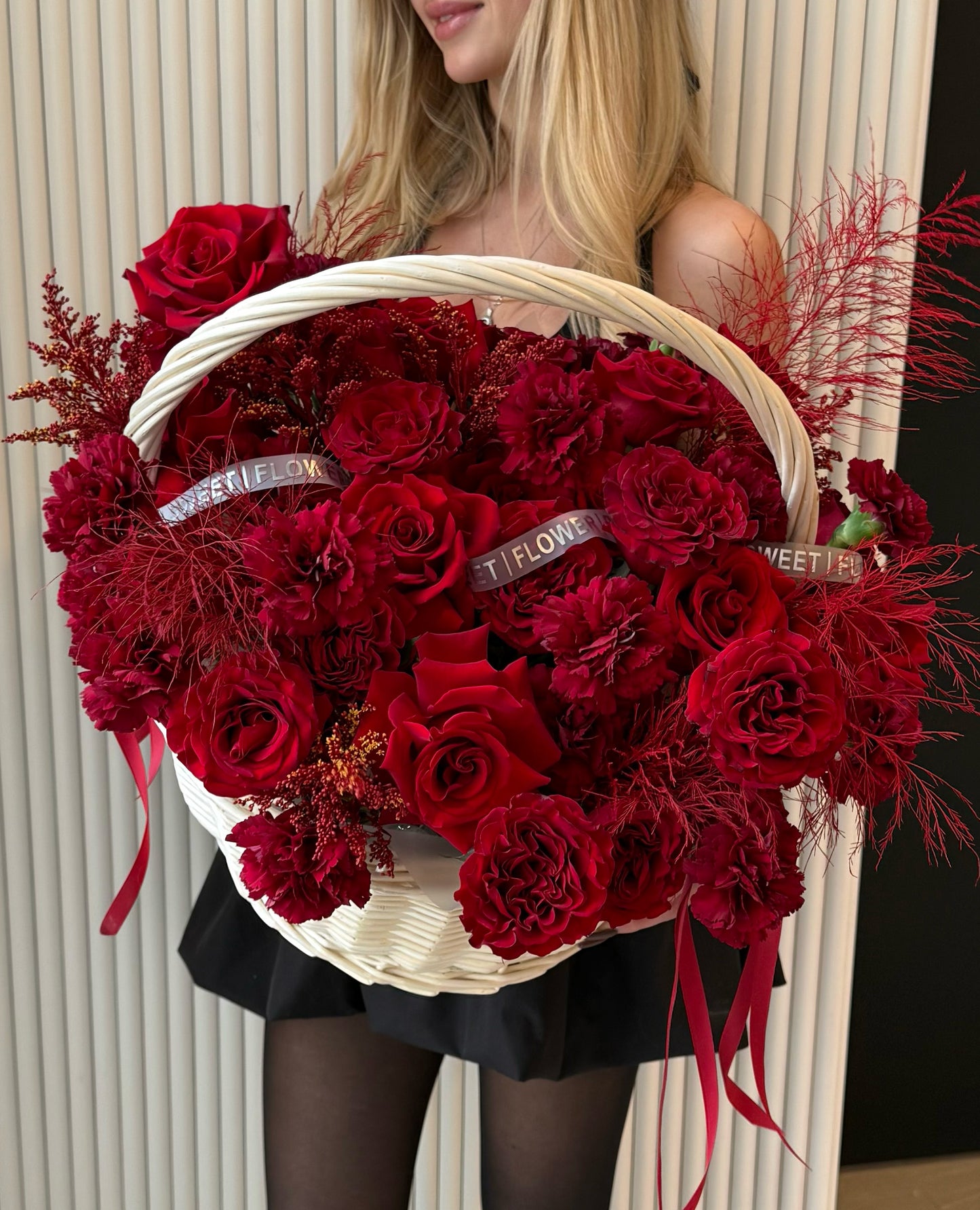 Luxury red floral arrangement in a natural rattan basket by Sweet Flower Boutique
